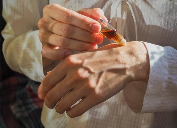 applying perfume oil